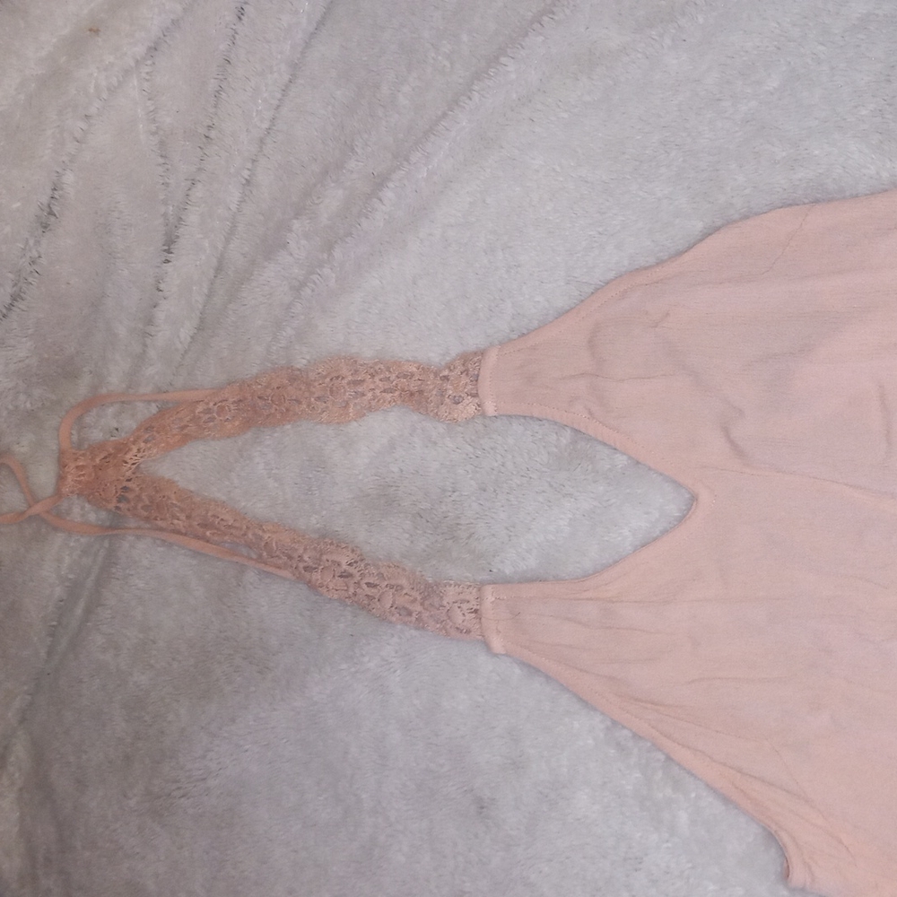 Peach colored backless dress with crochet bottom and top straps
